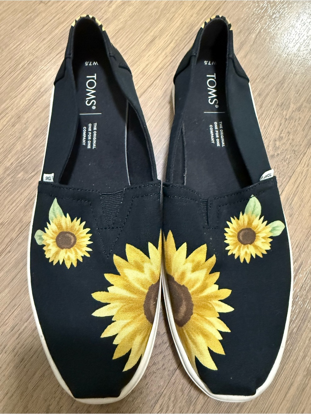 TOMS Black Canvas Slip-Ons with Yellow Sunflower Motif